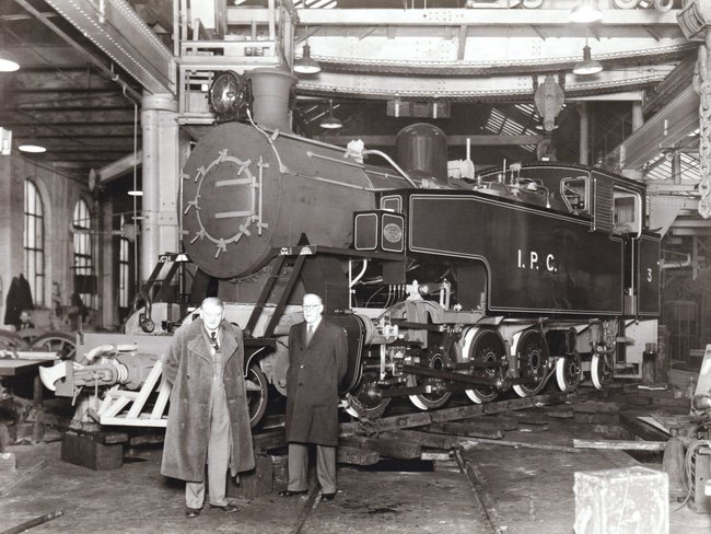 hc works managers pose in front of hc 1854 wdo